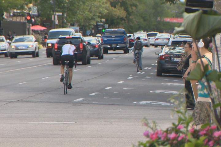Cyclists use the new reserved bike lane on Saint-Denis Street, Thursday, August 27, 2015.