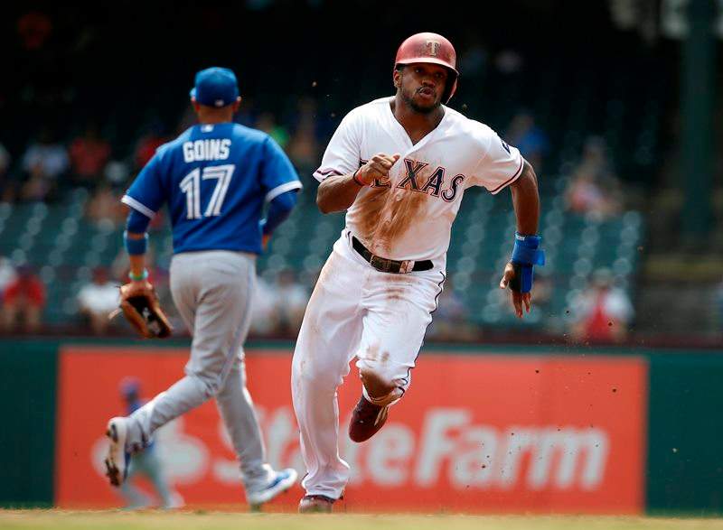 Texas Rangers' Delino DeShields advances to third on a single by Texas Rangers' Adrian Beltre in the first inning of a baseball game Thursday, Aug. 27, 2015, in Arlington, Texas. 