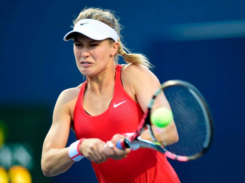 ugenie Bouchard, of Canada, returns to Belinda Bencic, of Switzerland, during tennis action at Rogers Cup in Toronto on Tuesday, August 11, 2015. 