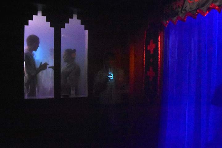 In this photo taken Monday, Aug. 3, 2015, customers stand inside the cocktail room called the “Cloud’’ by its inventors, which uses a humidifier to pump a gin and tonic vapour into an enclosed space.
