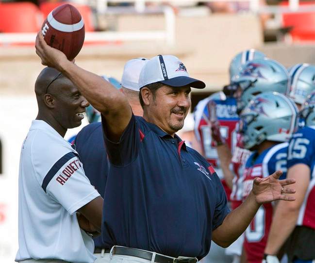 In this 2015 file photo, Montreal Alouette quarterback coach Anthony Calvillo loosens up before the game against the Calgary Stampeders. Calvillo will be joining the university ranks as assistant coach for Montreal Carabins  in 2019.