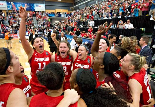 Canada celebrates their win over Cuba during second half action of the 2015 FIBA Americas Women's Championship Final in Edmonton on August 16, 2015. Saskatchewan Huskies women’s basketball team coach Lisa Thomaidis has had a golden summer as bench boss of national team.