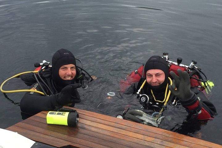 Volunteer divers taking part in search for missing  prosthetic leg earlier in the week in St-Donat, Que. Sunday, Aug. 2, 2015.