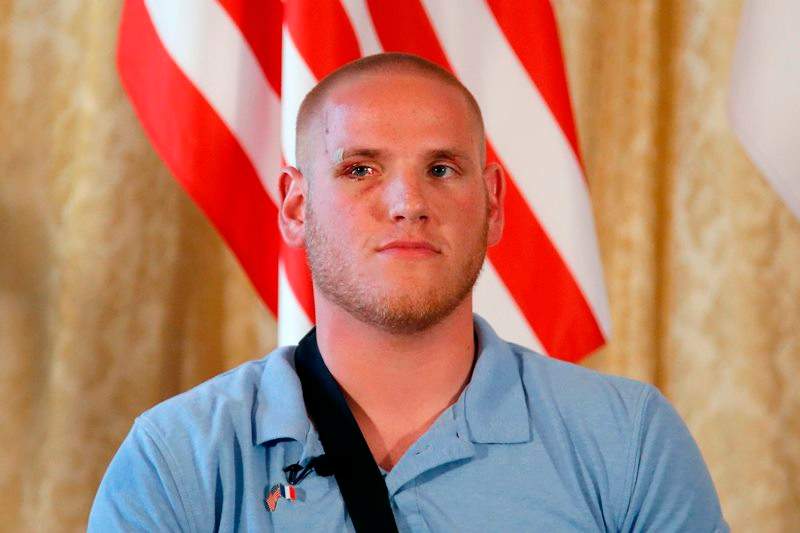 U.S. Airman Spencer Stone attends a press conference held at the U.S. Ambassador’s residence with Anthony Sadler, a senior at Sacramento University in California, U.S. National Guardsman from Roseburg, Oregon, with Alek Skarlatos with Jane D. Hartley, U.S. Ambassador to France, in Paris, France, Sunday, Aug. 23, 2015.