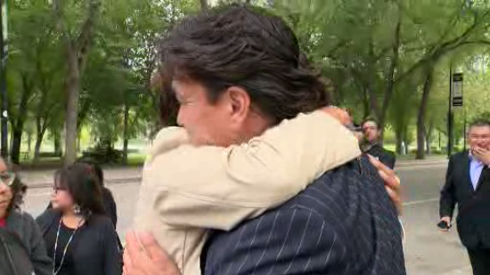 Whitecap Dakota First Nation Chief Darcy Bear hugs community member outside Queen’s Bench Court Friday.