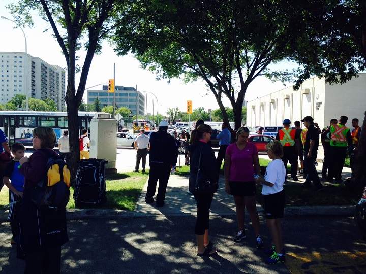 Kids from a hockey camp waiting outside the Winnipeg Winter Club during a gas leak