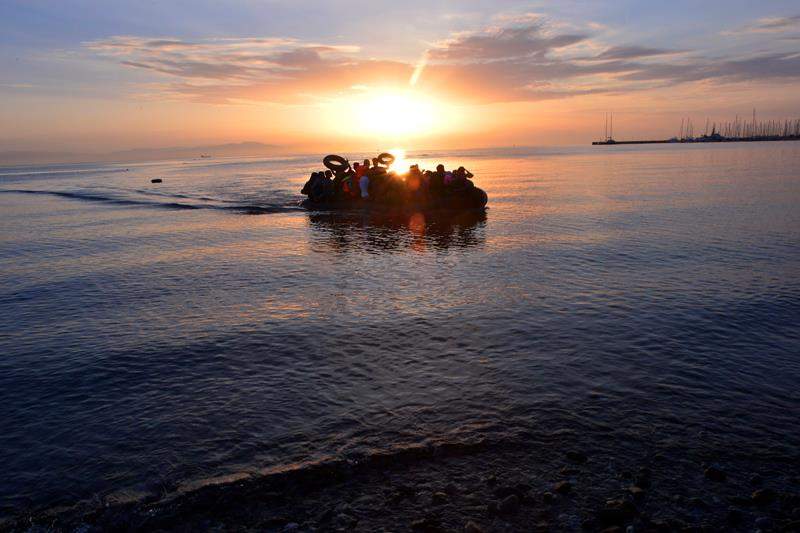A dinghy with Syrian refugees arrives at a beach on the Greek island of Kos after crossing a part of the Aegean sea from Turkey to Greece on August 15, 2015 in Kos, Greece.