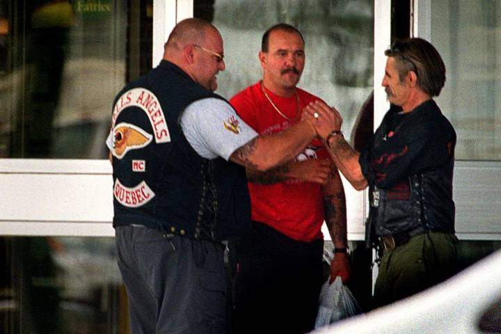  member of the Hells Angels motorcycle gang Quebec chapter (left) is greeted outside a hotel by a member of the Los Bravos in Winnipeg Friday July 21, 2000.
CP PHOTO/The Winnipeg Free Press-Phil Hossack.