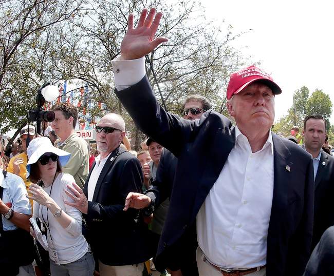 Republican presidential candidate Donald Trump waves to the crowd at the Iowa State Fair Saturday, Aug. 15, 2015, in Des Moines. 