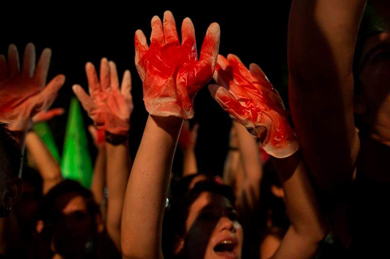Israeli members of the gay community and supporters rally, calling for a stop to the the violence in Tel Aviv, Israel, Saturday, Aug. 1, 2015. 