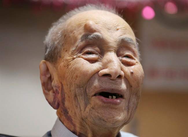 Yasutaro Koide, the 112-year-old living in the central Japanese city of Nagoya, smiles upon being formally recognized as the world's oldest man by the Guinness World Records at a nursing home in Nagoya Friday, Aug. 21, 2015. Koide was born on March 13, 1903 and worked as a tailor when he was younger. He became the world’s oldest man with the death of Sakari Momoi of Tokyo in July at age 112. (AP Photo/Koji Sasahara).