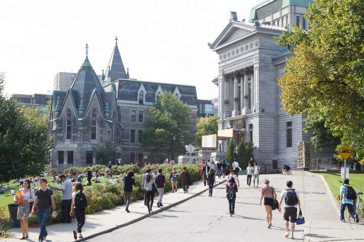 McGill entrance gate with students, Wednesday, August 19, 2015.