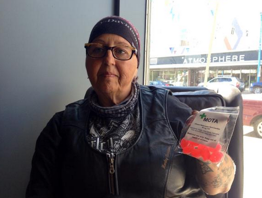 Gisele Cooke purchases medical marijuana infused candy from Saskatchewan Compassion Club in Saskatoon