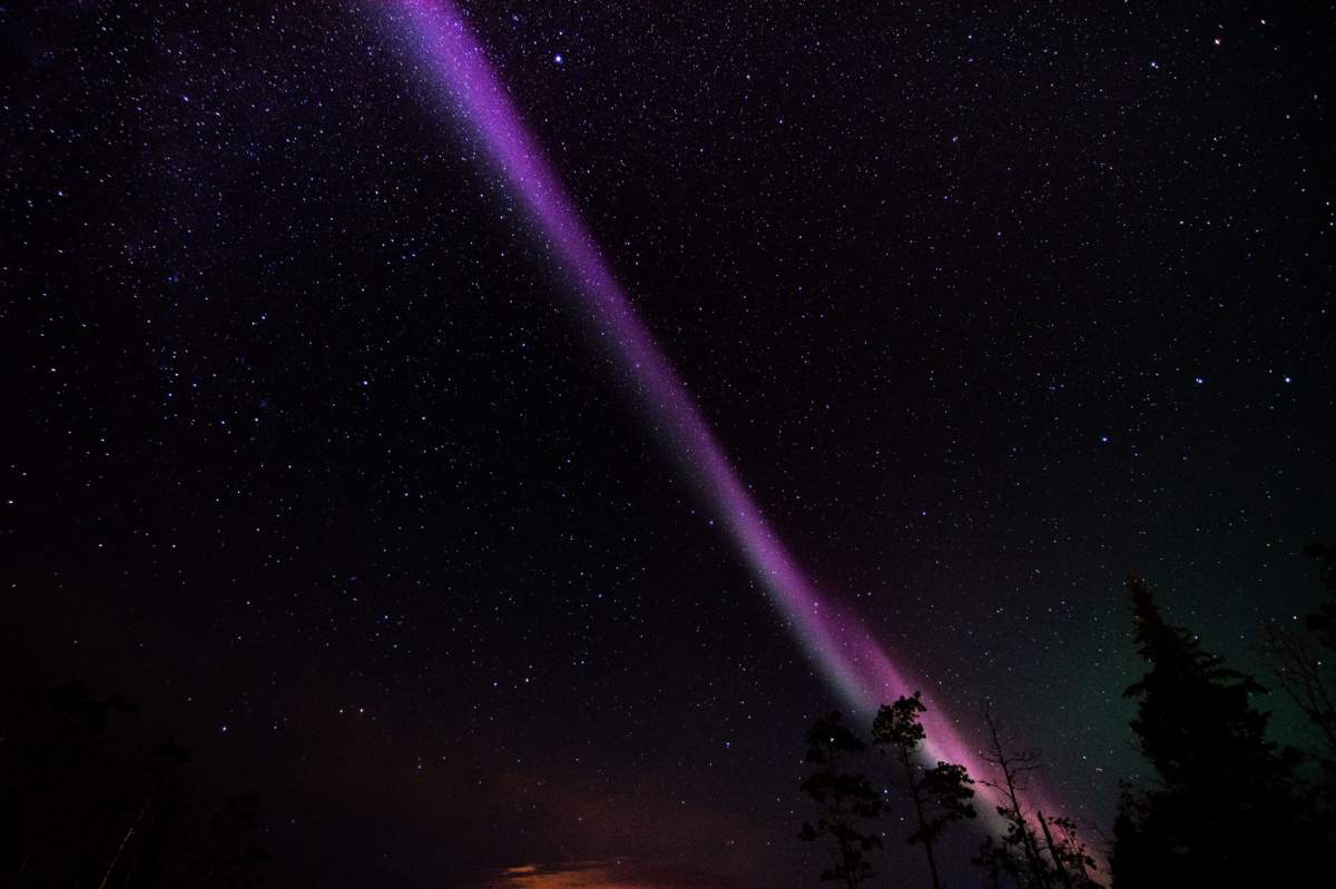 Mitch Popilchak captured a brightly coloured aurora arc near the Sibbald Flats, west of Calgary, AB, on Sunday August 16, 2015.