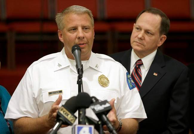 St. Louis police chief Sam Dotson, left, appeals for calm alongside mayor Francis Slay, Thursday, Aug. 20, 2015, West Side Missionary Baptist Church in St. Louis. 