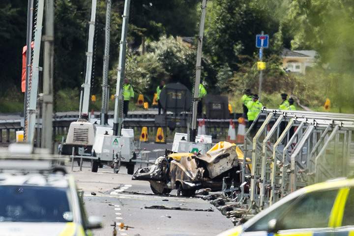 Wreckage is seen near the site where a Hawker Hunter fighter jet crashed on August 23, 2015 in Shoreham, England. 