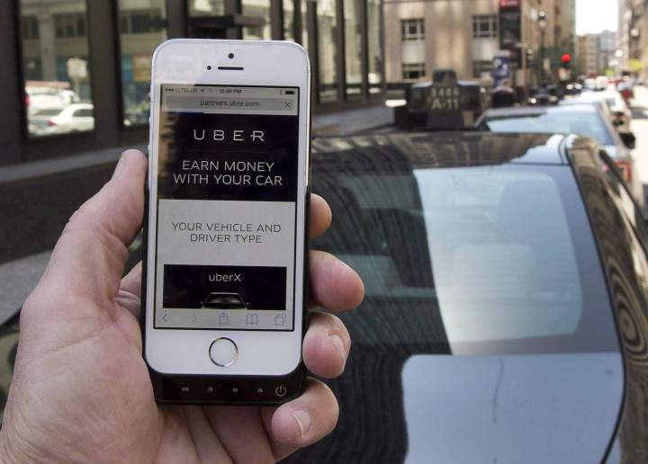 The ride-sharing app Uber is shown on a smartphone in Montreal, Thursday, May 14, 2015.