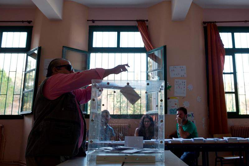 Lesbos, Greece’s third-largest island is bearing the brunt of the migrant crisis as more than 300,000 people have reached the country clandestinely so far this year. Greeks were voting Sunday in their third national poll this year, called on to choose who they trust to steer the country into its new international bailout.