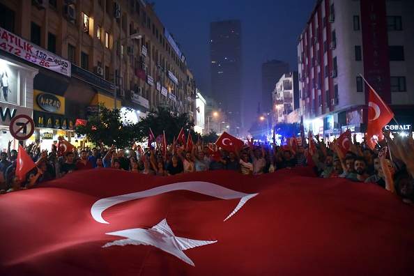 Hundreds of people attend a protest rally in Mersin on September 7, 2015 against the bomb attack perpetrated by PKK terrorists, which killed sixteen soldiers and wounded six in Daglica in the southeastern province of Hakkari on September 6, 2015. (Photo by Sezgin Pancar/Anadolu Agency/Getty Images).