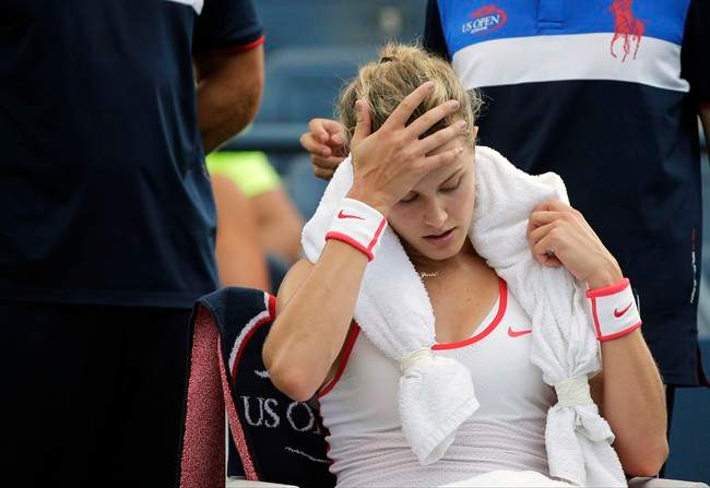 Eugenie Bouchard, of Canada, takes a break between games against Dominika Cibulkova, of Slovakia, during the third round of the U.S. Open tennis tournament, Friday, Sept. 4, 2015, in New York. Bouchard has withdrawn from the U.S. Open with a concussion.