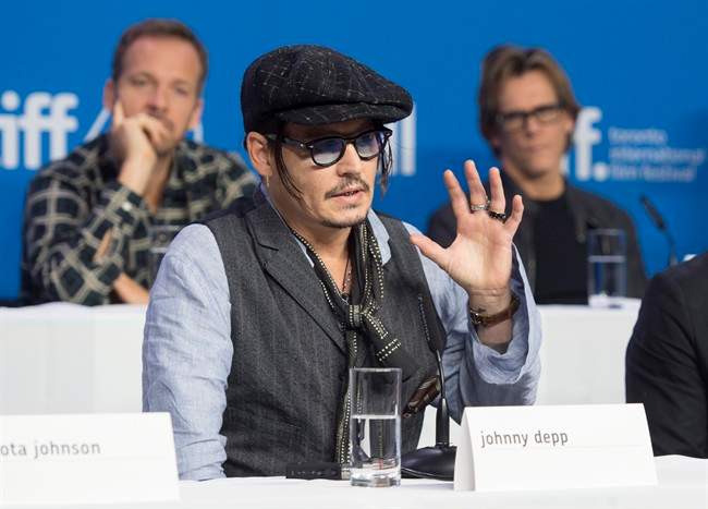 Actor Johnny Depp gestures during a press conference promoting the film "Black Mass" during the 2015 Toronto International Film Festival in Toronto on Monday, September 14, 2015.