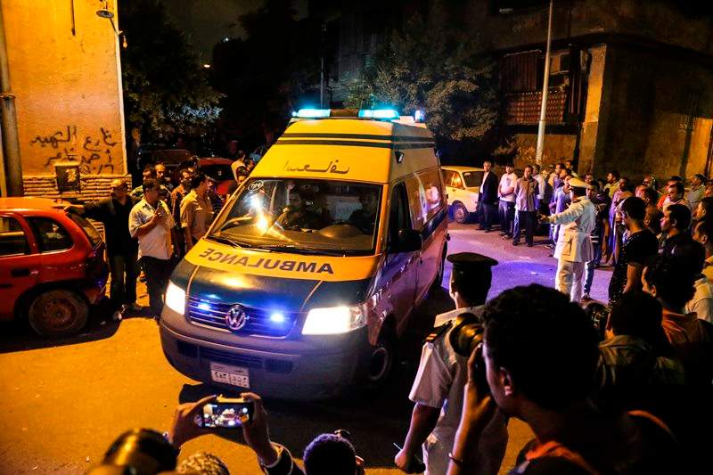 An ambulance carrying an Egyptian victim of Sunday's incident in which Egyptian forces mistakenly opened fire on tourists in the western desert, arrives at a morgue in Cairo, Egypt, Monday, Sept. 14, 2015. 