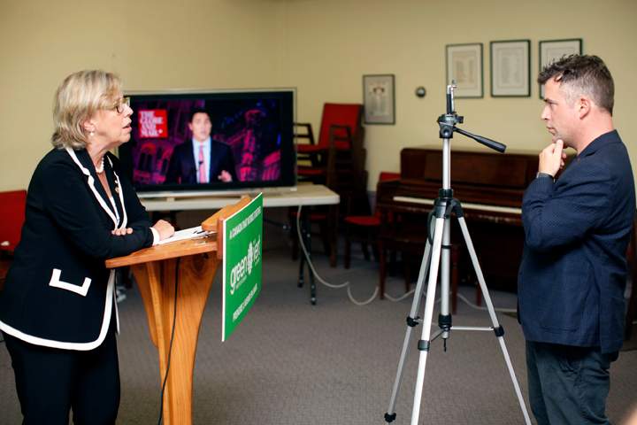 Twitter Canada, Steve Ladurantaye, records Green Party leader Elizabeth May, on his smart phone, to be uploaded to Twitter as she live-tweets to leaders during the Globe and Mail leaders’ debate, in Victoria, B.C., on Thursday, September 17, 2015. The Green party leader wasn’t invited to the Calgary event hosted by the Globe and Mail newspaper, but she’s using Twitter to try to elbow her way into the conversation. THE CANADIAN PRESS/Chad Hipolito