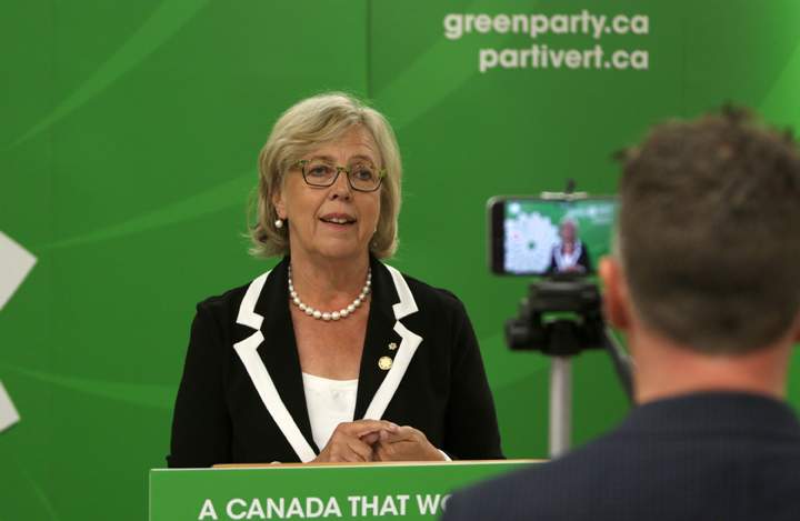 Twitter Canada, Steve Ladurantaye, records Green Party leader Elizabeth May, on his smart phone, to be uploaded to Twitter as she live-tweets to leaders during the Globe and Mail leaders' debate, in Victoria, B.C., on Thursday, September 17, 2015. Providing a real-time 30-second or less Tweet during the debate. THE CANADIAN PRESS/Chad Hipolito.