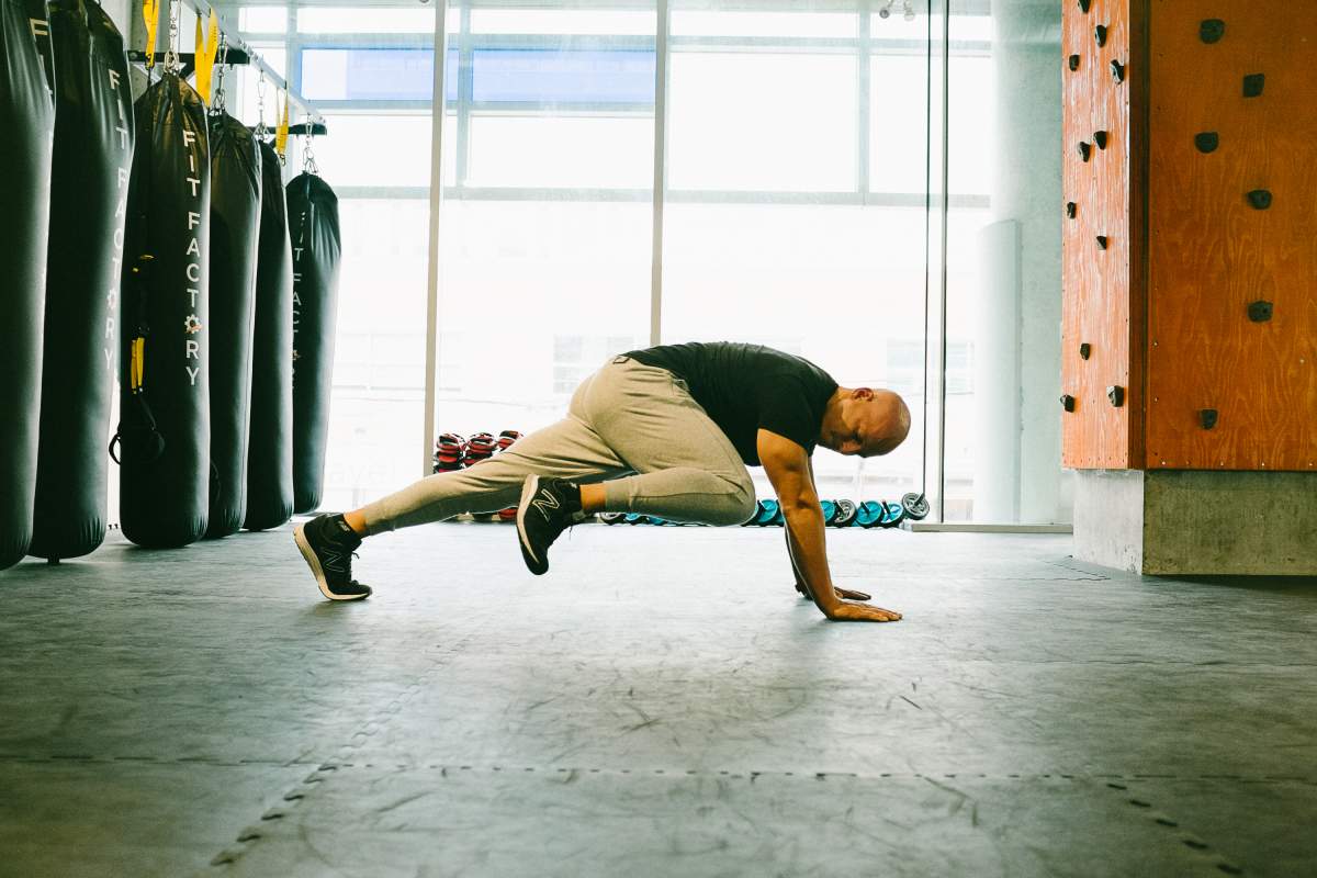 Celebrity trainer Harley Pasternak demonstrates how to do a Spider Plank.