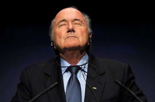 FILE - In this Nov. 19, 2010 file photo FIFA President Sepp Blatter pauses during a press conference following a meeting of the Executive Committee in Zurich, Switzerland. On Friday, Sept. 25, 2015 Swiss attorney general opened criminal proceedings against FIFA President Sepp Blatter. (Steffen Schmidt/Keystone via AP).
