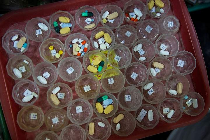 Pills are prepared for HIV/AIDS patients on February 21, 2015 at Wat Phra Bat Nam Phu in Lop Buri, Thailand.