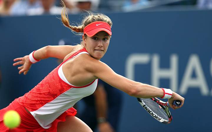 Eugenie Bouchard returns a shot to Dominika Cibulkova of Slovakia during their Women's Singles Third Round match  on Day Five of the 2015 US Open at the USTA Billie Jean King National Tennis Center on September 4, 2015 in the Flushing neighborhood of the Queens borough of New York City.