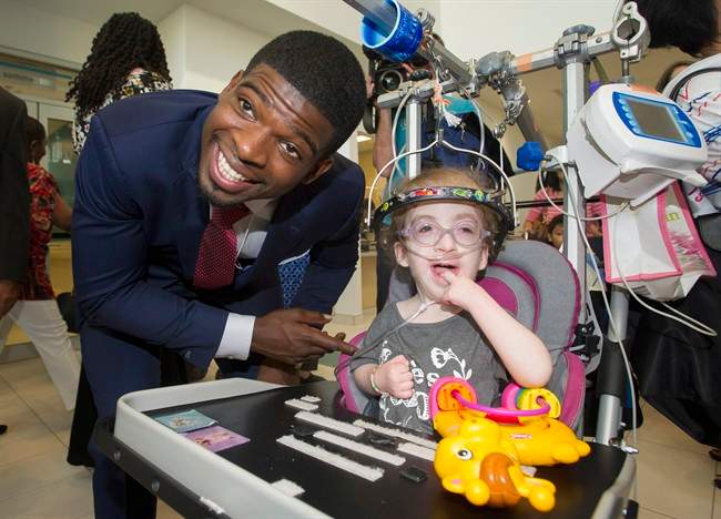 Montreal Canadiens defenceman P.K. Subban meets a young patient following a press conference at the Children's Hospital in Montreal, Wednesday, September 16, 2015, where he announced that his foundation would pledge $10-million to the hospital.