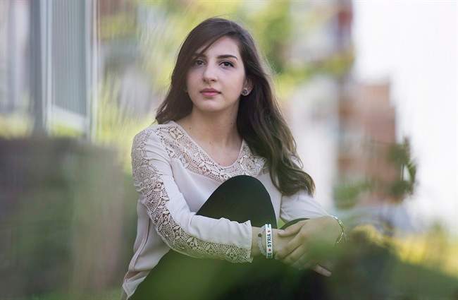 Psychology student Yaman Alqadri poses for a photograph outside her apartment in Montreal, Friday, September 11, 2015. Alqadri moved to Canada from Syria in 2012.