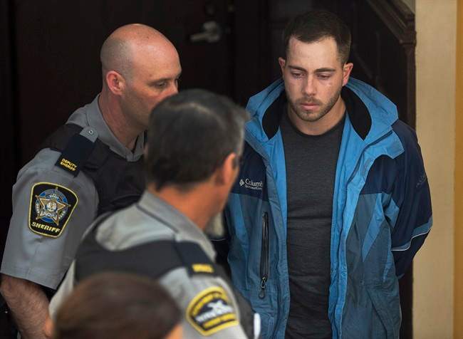Christopher Calvin Garnier, charged with second-degree murder in the death of Constable Catherine Campbell , an off-duty police officer, arrives at provincial court in Halifax on Thursday, Sept. 17, 2015.