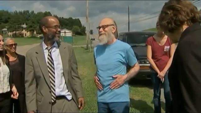 Lewis Fogle, 63, flanked by his attorneys.