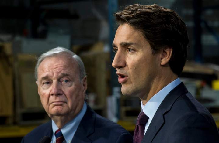 Liberal leader Justin Trudeau addresses supporters next to former prime minister Paul Martin Friday, August 28, 2015 in Montreal. THE CANADIAN PRESS/Paul Chiasson.