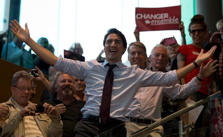 Liberal Leader Justin Trudeau reacts to the crowd as he arrives at a campaign stop in Orleans, Ont., on Sept. 21, 2015.