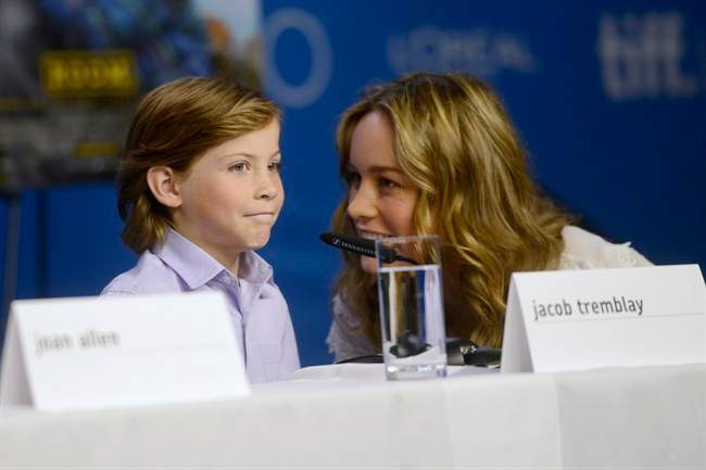 Actors Jacob Tremblay, left, and Brie Larson attend the press conference for "Room" at the 2015 Toronto International Film Festival in Toronto, Monday, Sept, 14, 2015.