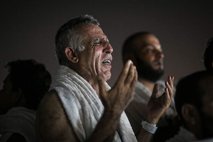 Muslim pilgrims pray on a rocky hill called the Mountain of Mercy, on the Plain of Arafat, near the holy city of Mecca, Saudi Arabia, Wednesday, Sept. 23, 2015 during the hajj pilgrimage. 