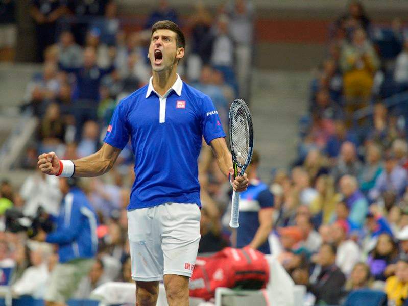 Novak Djokovic of Serbia reacts as he plays Roger Federer of Switzerland during the men's final on the fourteenth day of the 2015 US Open Tennis Championship at the USTA National Tennis Center in Flushing Meadows, New York, USA, 13 September 2015. The US Open runs through 13 September, which is a return to a 14-day schedule. 