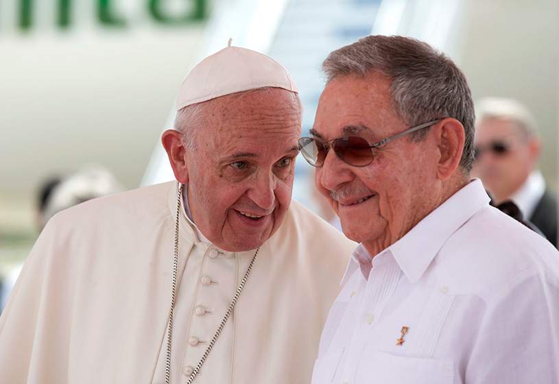 Pope Francis speaks with Cuba’s President Raul Castro during his farewell ceremony at the airport in Santiago, Cuba, Tuesday, Sept. 22, 2015.