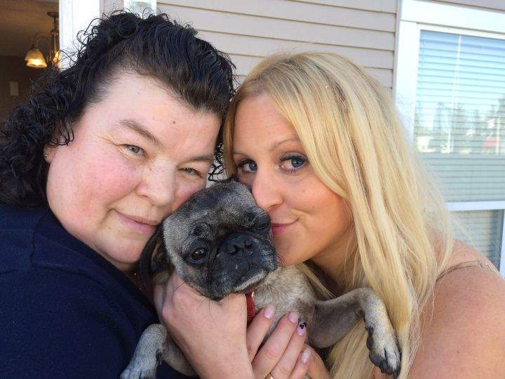Dog owner Justine Holmlund (right) was reunited with her pug after five years, with help from amateur pet detective Giovanna Carabella (left).
