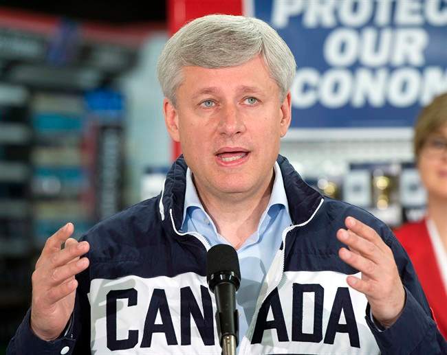 Conservative Leader Stephen Harper speaks to the media while campaigning at a hardware show, Monday, September 21, 2015 in St. Jacobs, Ont.