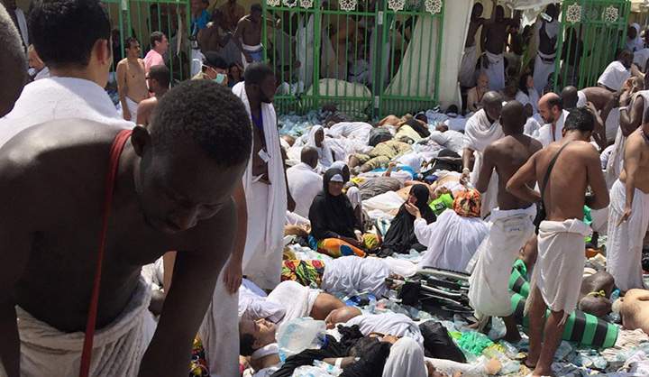 Muslim pilgrims gather around the victims of a stampede in Mina, Saudi Arabia during the annual hajj pilgrimage on Thursday, Sept. 24, 2015.