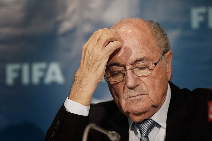 In this Dec. 19, 2014 file photo FIFA President Sepp Blatter gestures as he attends a press conference in Marrakech, Morocco. 