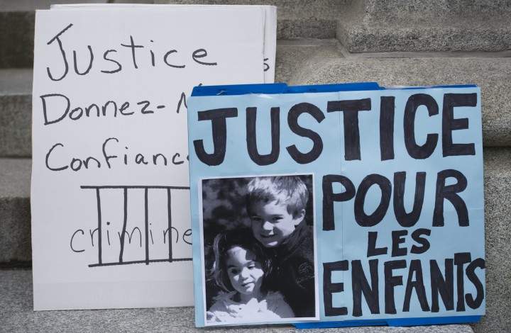 A sign with a photograph of Olivier and Anne-Sophie Turcotte is seen outside the Court of Appeal in Montreal, Monday, November 10, 2014.