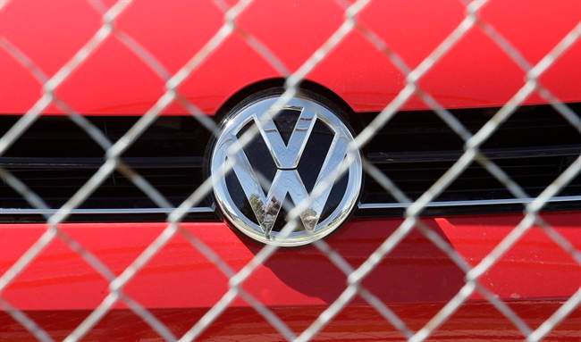 A Volkswagen diesel sits behind a security fence on a storage lot near a VW dealership in Salt Lake City. Volkswagen CEO Martin Winterkorn resigned Wednesday, days after admitting that the world's top-selling carmaker had rigged diesel emissions to pass U.S. tests during his tenure. (AP Photo/Rick Bowmer)