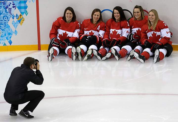 Canada’s women’s ice hockey team players Gillian Apps, from left, Jayna Hefford, Catherine Ward, Marie-Philip Poulin and Haley Irwin pose for a photograph during a training session ahead of the 2014 Winter Olympics, Thursday, Feb. 6, 2014, in Sochi,
