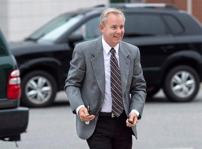 Dennis Oland arrives at the Law Courts in Saint John, N.B. on Wednesday, Sept. 9, 2015 as jury selection continues for his trial. .